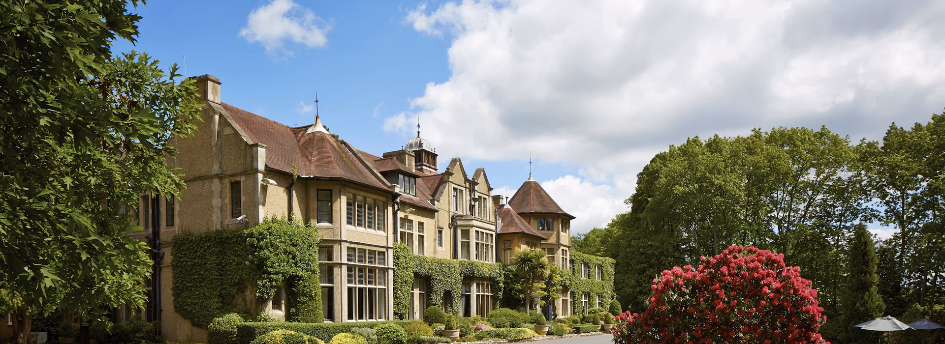 What time is check-in and check-out at Macdonald Frimley Hall Hotel & Spa?